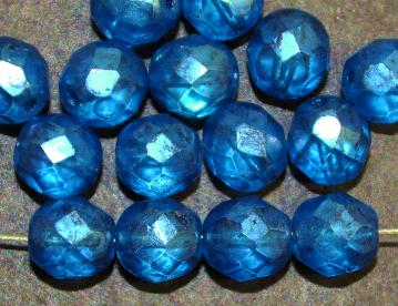 facettierte Glasperlen
 mit Wachsüberzug blau