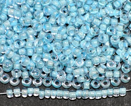 Rocailles von Ornella Preciosa Tschechien, 
 kristall mit Farbeinzug hellblau mit lüster