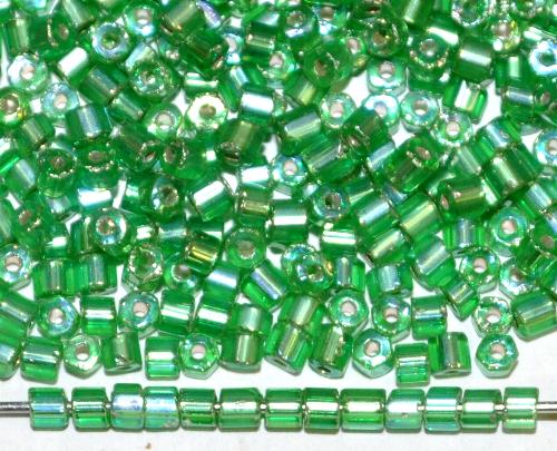 2 cut beads von Ornella Preciosa Tschechien, 
 grün transp. mit light AB und Silbereinzug 