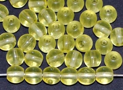 Glasperlen rund
 gelb transparent Uranglas leuchtet unter Schwarzlicht,
 hergestellt in Gablonz / Tschechien