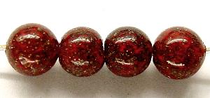 Wickelglasperle in rot
 mit winzigen aufgeschmolzenen Goldstone (aventurin) Stückchen
 um 1940 in Böhmen von Hand gefertigt