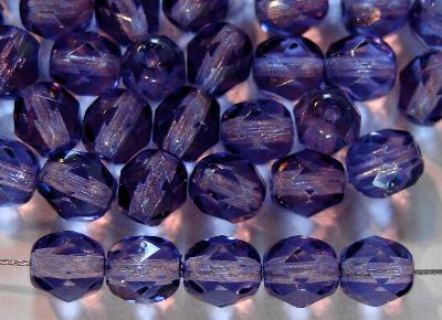 facettierte Glasperlen
 mit Wachsüberzug blauviolett