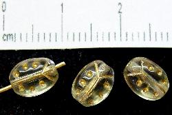 Glasperlen Käferchen
 Vorder-und Rückseite geprägt,
 kristall leicht rauchig mit Goldauflage,
 hergestellt in Gablonz / Tschechien