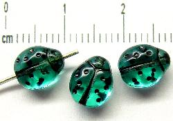 Glasperlen
 Käferchen
 smaragdgrün
 Vorder-und Rückseite geprägt